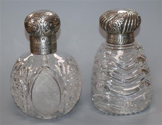 Two late Victorian silver mounted cut glass scent bottles, one with swirl glass decoration, John Grinsell & Sons, Birmingham, 1890,